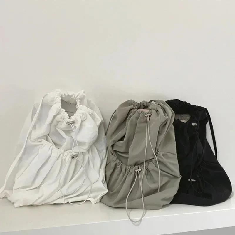 UAKISS  -  Korean Casual Nylon High-capacity Students Backpack Simple All Match Drawstring Pleated Schoolbags Women Vintage Solid Backpacks