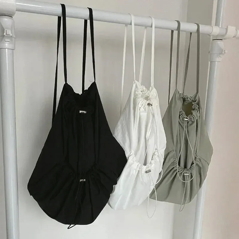 UAKISS  -  Korean Casual Nylon High-capacity Students Backpack Simple All Match Drawstring Pleated Schoolbags Women Vintage Solid Backpacks
