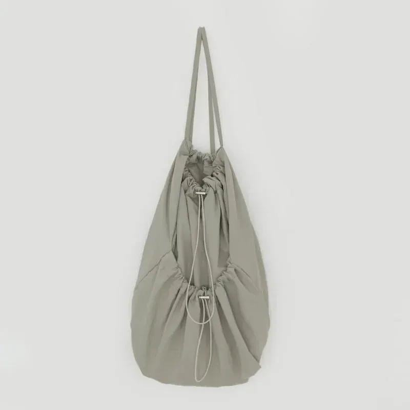 UAKISS  -  Korean Casual Nylon High-capacity Students Backpack Simple All Match Drawstring Pleated Schoolbags Women Vintage Solid Backpacks